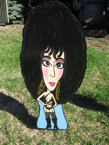 Hate your neighbors? This Cher lawn ornament from GreatDealsAreUs should keep them away.
