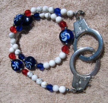 Nothing says "freedom" like a red, white, and blue handcuff bracelet.